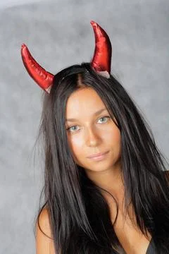 Sexy devil sexy devil with long hair against grey background ,model releas... Stock Photos