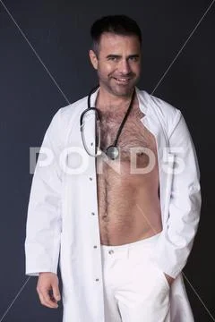 Sexy doctor showing his bare chest Stock Image ~ #76597196