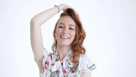 Sexy female model posing with red hair, white background, girl smiling and laugh Stock Footage 106281815