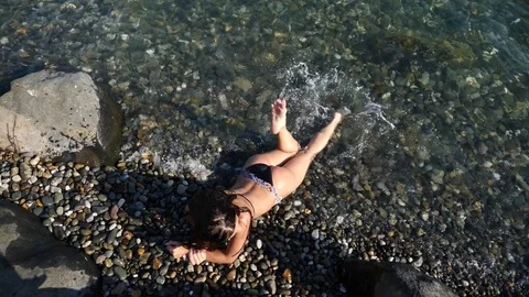 Sexy girl brunette enjoys the sea. Slow motion. 4K. Stock Footage