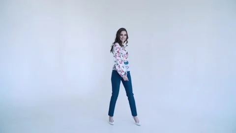 Sexy girl on a white background posing and smiling, glamorous girl, fashion Video stock 135302005