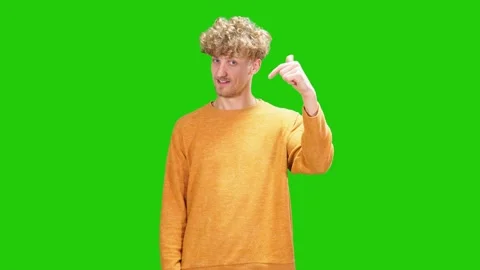 Sexy guy invites himself.Green Screen.guy in yellow sweater calls to himself 스톡 동영상 170312349