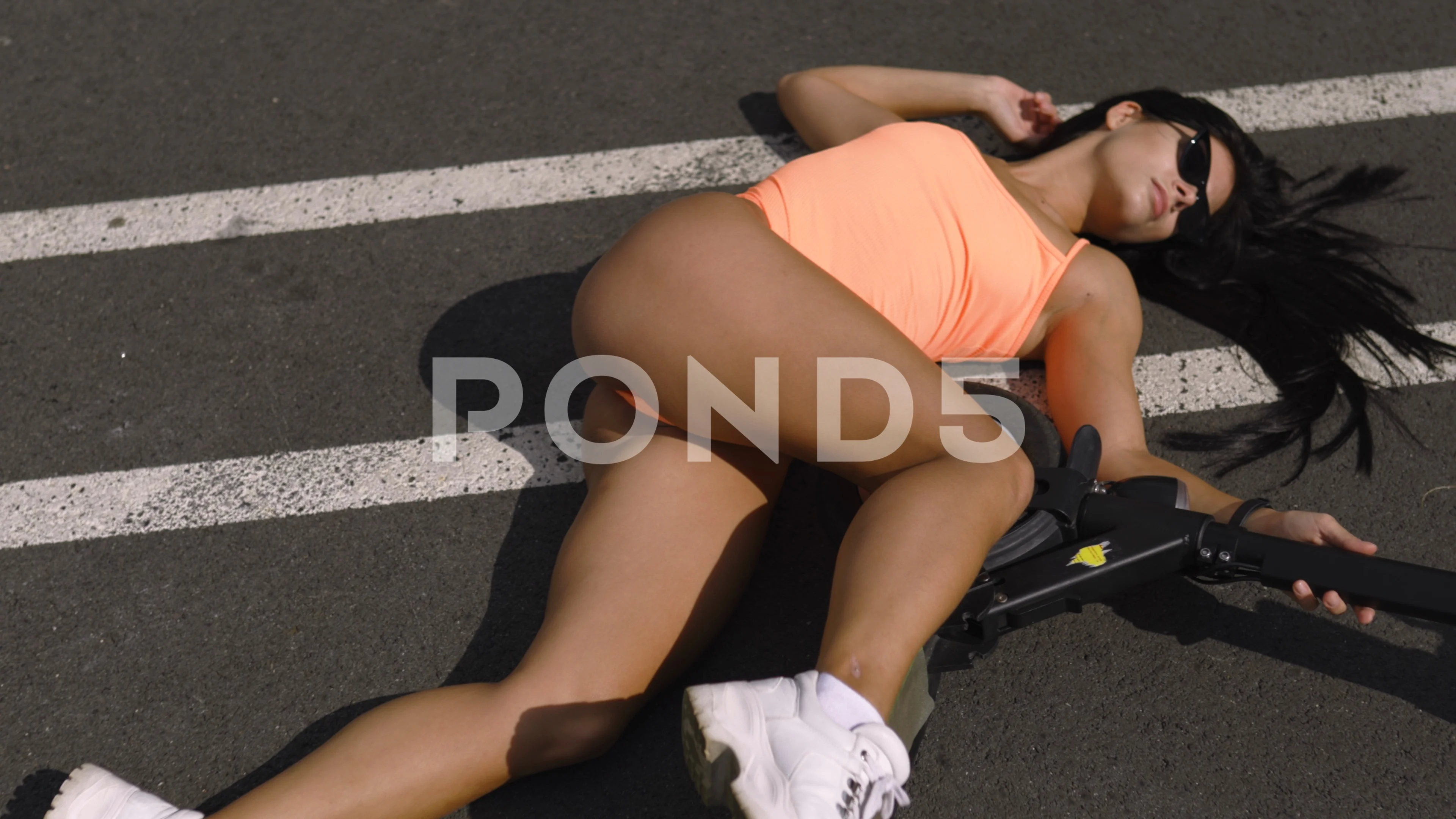 Sexy hot woman laying at electric scooter Traffic accident crash concept at