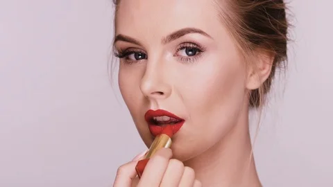 Sexy lady doing make-up with red lipstick Stock Footage 110206742