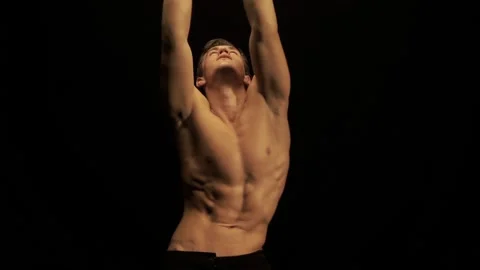 Sexy man dance on black background Stock Footage 89915666