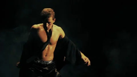 Sexy man dance on black background | Stock Video | Pond5