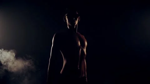 Sexy man is dancing on black background Vídeos de archivo 93309707