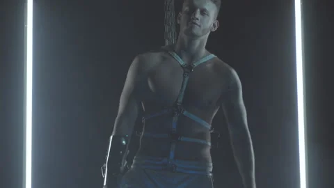 Sexy man dancing with chains in smoke Stock Footage 146298421