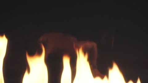 Sexy Man dancing in fire Stock Footage 140386774