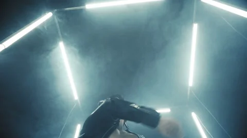 Sexy man dancing in light cube Stock Footage 133386977