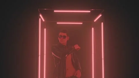 Sexy man dancing in light cube in smoke Stock Footage 133902166