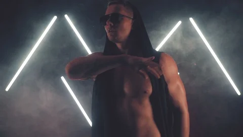 Sexy man dancing in light 스톡 동영상 105489384