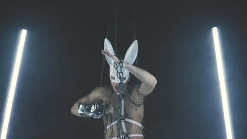 Sexy man dancing in a rabbit mask Stock Footage 145859313
