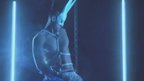 Sexy man dancing in a rabbit mask Stock Footage 145859848