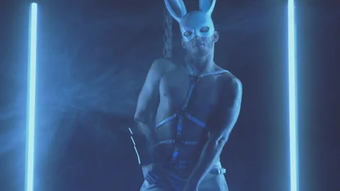 Sexy man dancing in a rabbit mask Stock Footage 145859941