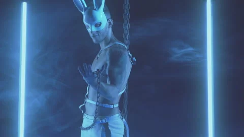 Sexy man dancing in a rabbit mask Stock Footage 145860053