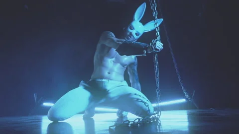 Sexy man dancing in a rabbit mask Stock Footage 145860210