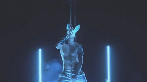 Sexy man dancing in a rabbit mask Stock Footage 145944566