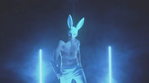 Sexy man dancing in a rabbit mask Stock Footage 145945014