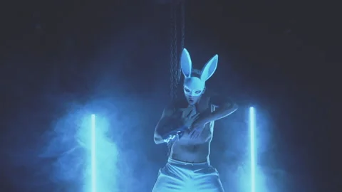 Sexy man dancing in a rabbit mask Stock Footage 145945272