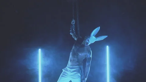 Sexy man dancing in a rabbit mask Stock Footage 145945346