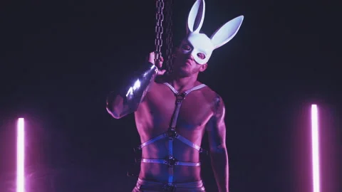 Sexy man dancing in a rabbit mask Stock Footage 145958134