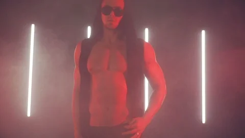 Sexy man dancing in red light Stock Footage 105551745