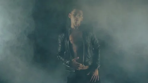 Sexy man dancing in smoke Video stock 92556143