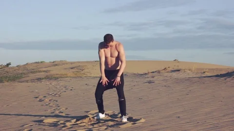 Sexy man in desert Stock Footage 78154329