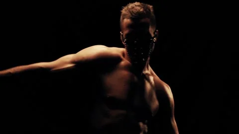 Sexy man in mask on black background Видео 88705871