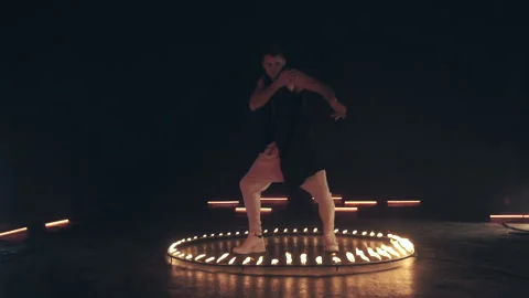 Sexy Man in mask dancing in fire Stock Footage 142643840