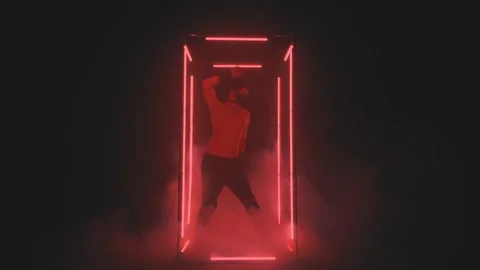 Sexy man in mask dancing in red light Stock Footage 133205366