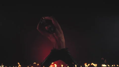 Sexy man in mask dancing in smoke and fire Stock Footage 140206053