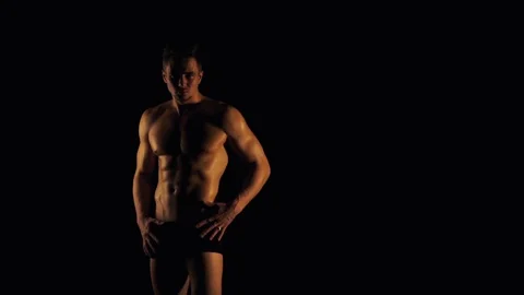 Sexy man posing on black background Stock Footage 99614645