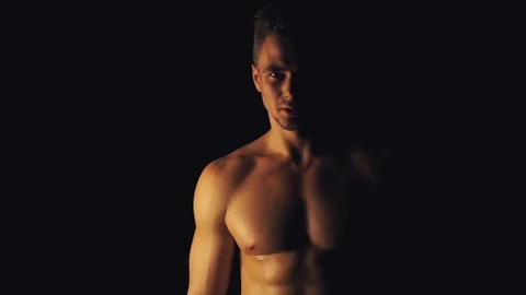 Sexy man posing on black background 스톡 동영상 99701827