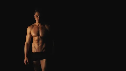 Sexy man posing on black background Stock Footage 100246599