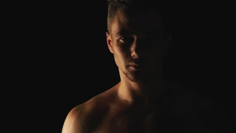 Sexy man posing on black background Stock Footage 100277934
