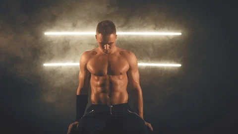 Sexy man sitting Stock Footage 106571960