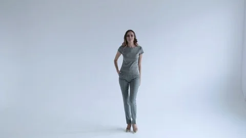 Sexy model with beads posing on white background, slow mo Stock Footage 106282292