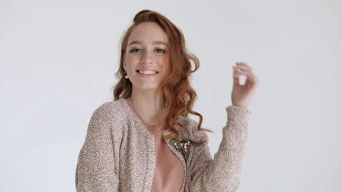 Sexy model posing, stroking her hair, twisting her hair, smiling and having fun Stock Footage 106283881