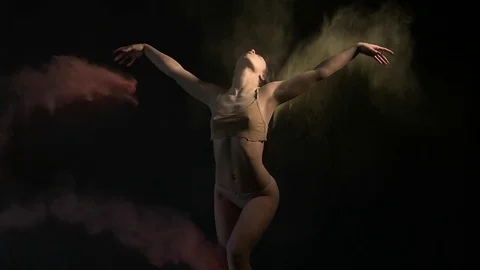 Sexy model in studio posing with paints holi Stock Footage 81629709