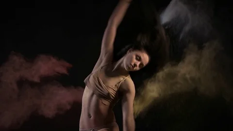 Sexy model in studio posing with paints holi Stock Footage 81631170