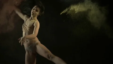 Sexy model in studio posing with paints holi Stock Footage 81631407