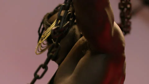 Sexy muscle man with chains Stock Footage 220020450
