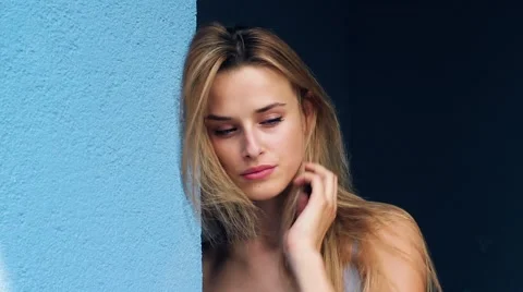 A Sexy, Seductive Poses For the Camera While Standing in the Street. Street Stock-Footage 65449633