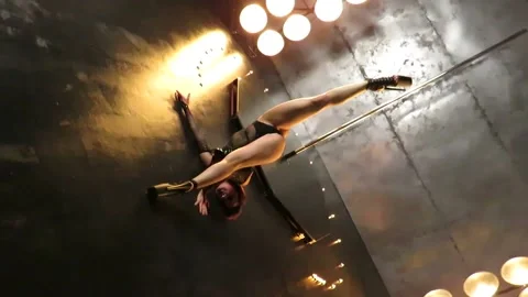 Sexy stripper dancer dancing on a pole in erotic underwear Stock Footage 222093641