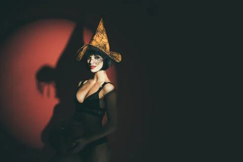 Sexy stripper Woman with pumpkins. Halloween lingerie model. Vampire girls Stock Photos