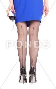 Sexy stylish legs in black sheer stockings Stock Photos