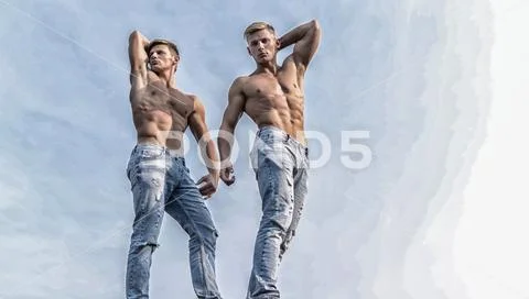 Sexy torso attractive body. Denim pants emphasize masculinity sexuality. Men Stock Photos