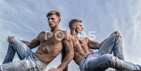 Sexy torso attractive body. Denim pants emphasize masculinity sexuality. Men Stock Photos